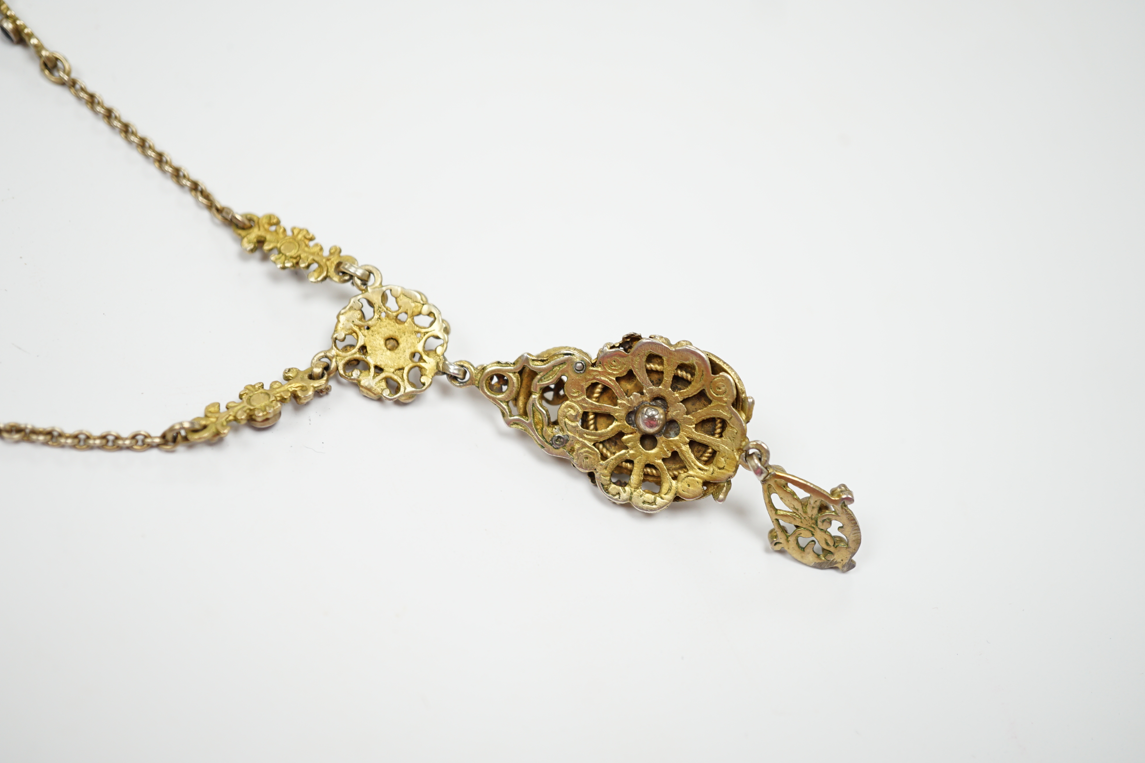 A 19th century Austro Hungarian, gilt white metal, moonstone, split pearl and gem set drop pendant necklace, overall 56cm.